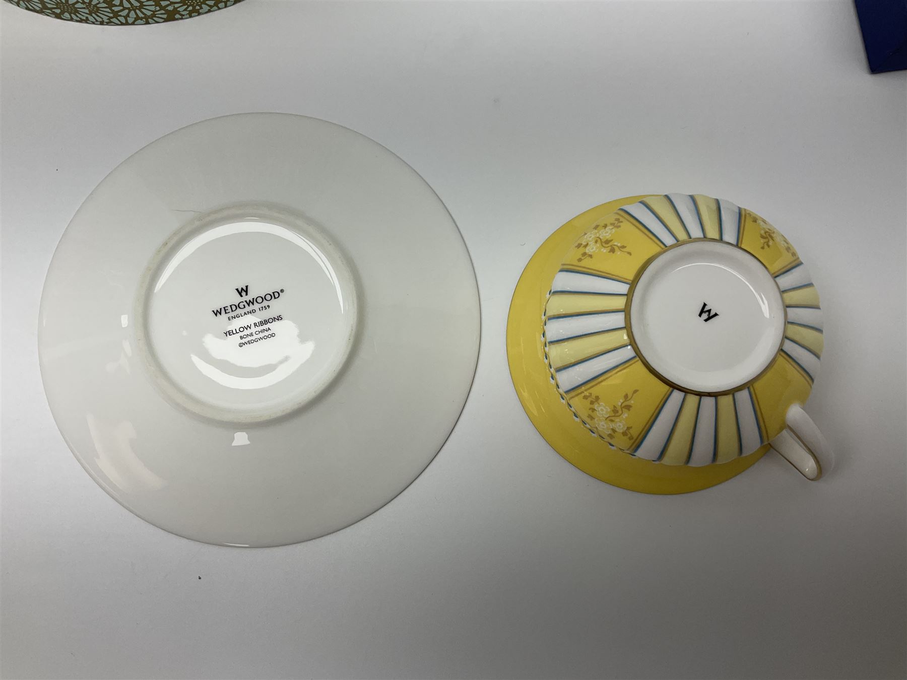 Wedgwood Yellow Ribbons cabinet cup and saucer, boxed and a Swarovski butterfly, boxed (2)