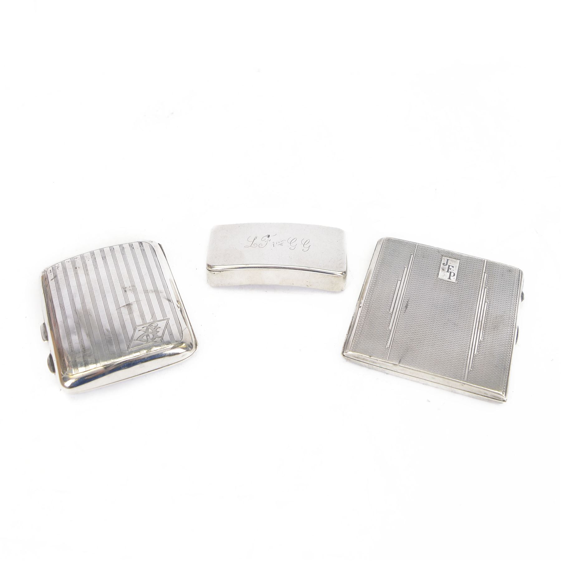 George III silver snuff box, of curved rectangular form with personal engraving to lid, hallmarked London 1805, together with two 1920s/30s silver cigarette cases, both hallmarked