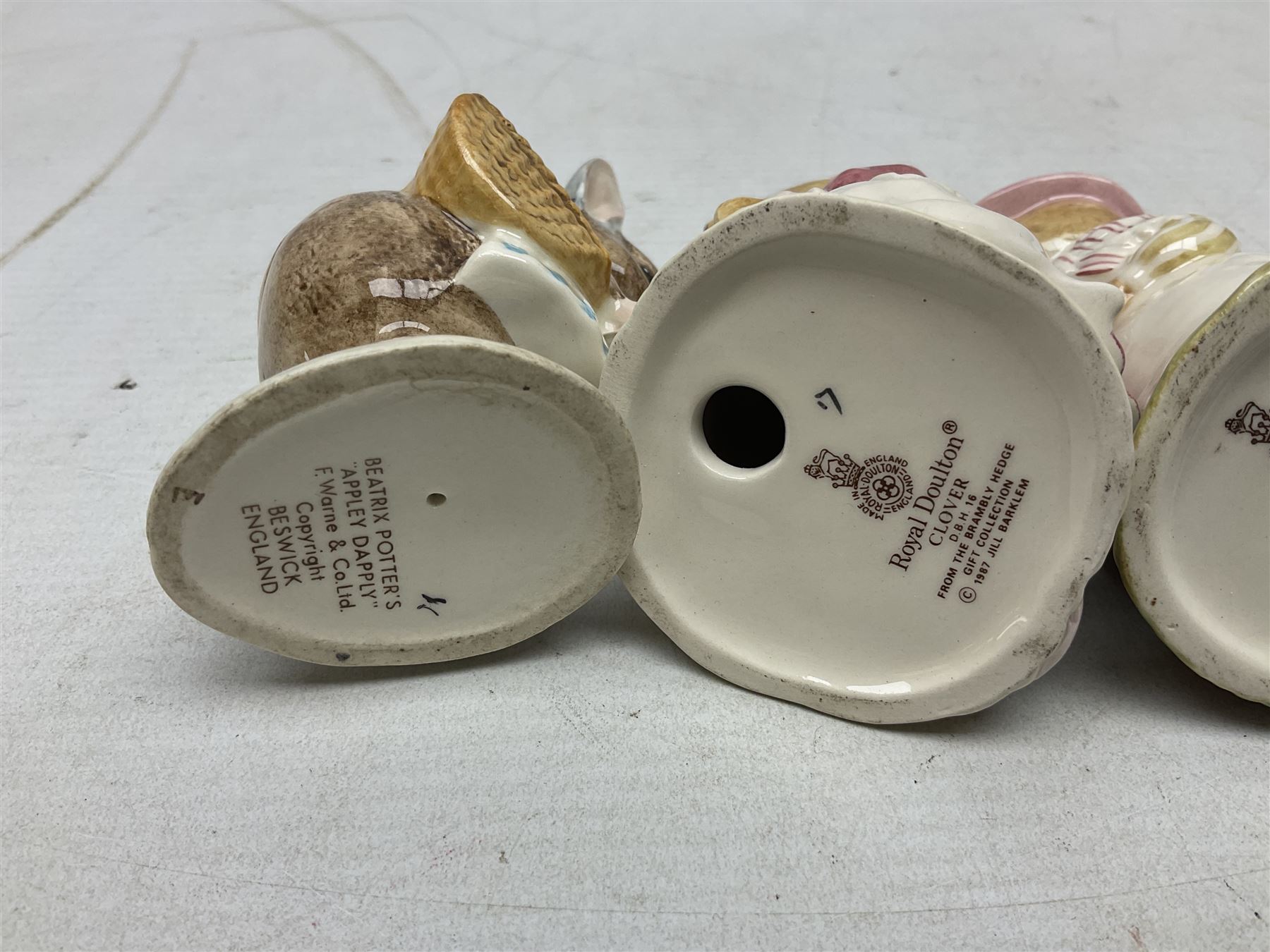 Six Royal Doulton Brambly Hedge figures, comprising Catkin DBH 12, Clover DBH 16, Lord Woodmouse DBH 4, Poppy Eyebright DBH 1, Mr Apple DBH 2, Old Mrs Eyebright DBH 9 and Beswick Beatrix Potter Appley Dapply figure, all with printed marks beneath