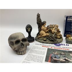 Terry Pratchett Discworld figures, designed by Clarecraft, comprising Cohen the barbarian, DW42, the Patrician, boxed, DW37, three Potions, DW18, DW19, DW20, two Death Bookstamps, DW50, the Gods Dice Box, boxed, DW26, together with two Discworld newsletters, volume 5, August 1998 and volume 6, August 1999. 