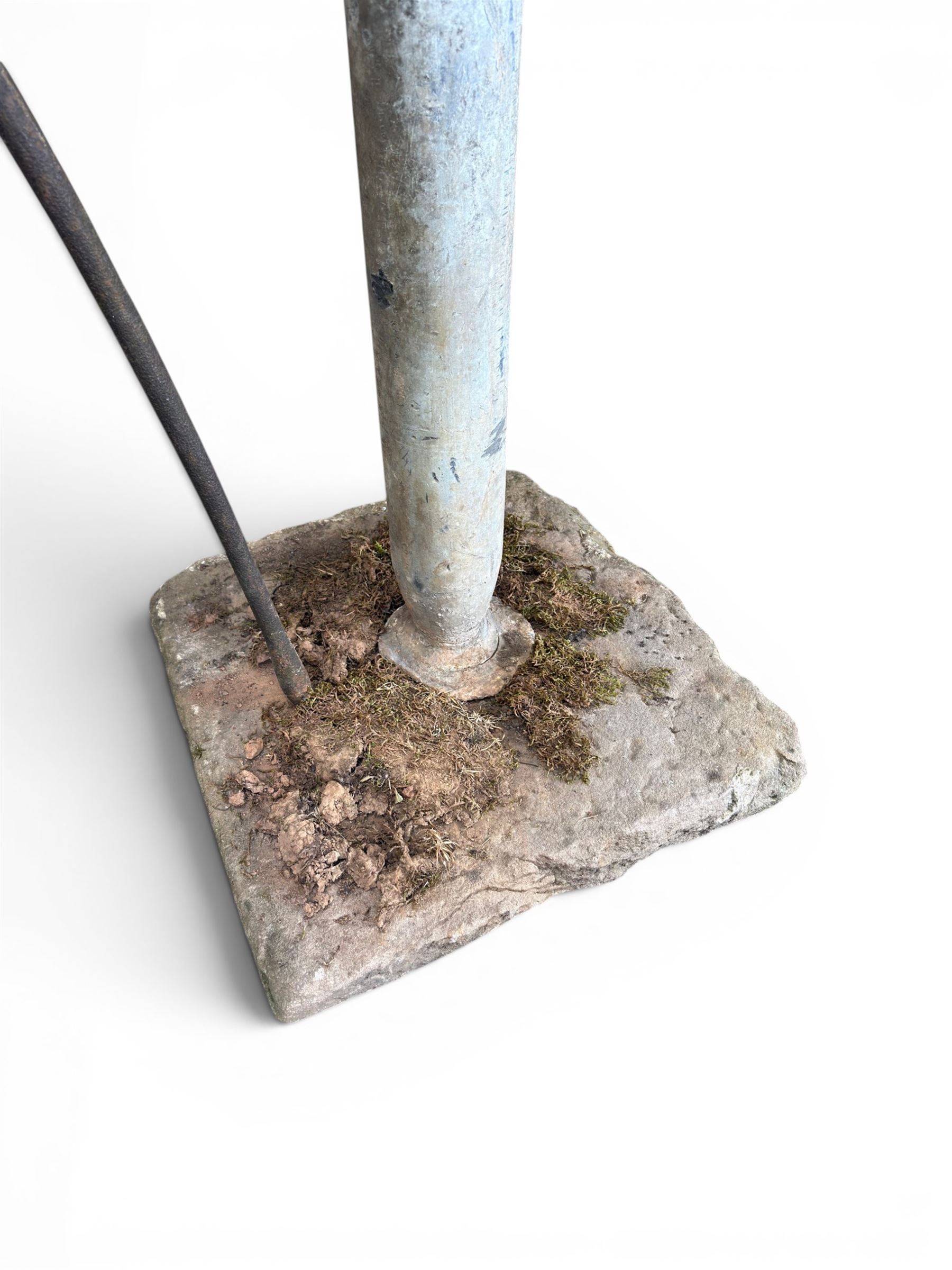 Georgian period lead garden water pump, with iron handle, set in square stone base