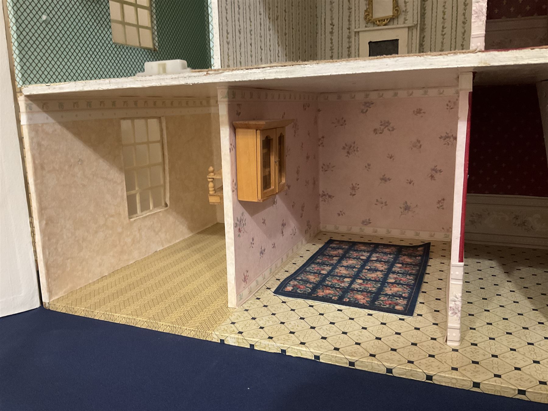 Modern scratch-built Palladian style wooden dolls  house as a 19th century double fronted two-storey property with simulated brick and stone walls under a removable simulated slate hipped roof; the triple hinged front elevation opening to reveal six rooms with central hall, stairs and landing L94cm H56cm D40cm