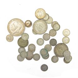 Queen Victoria 1891 silver crown coin, Queen Victoria 1849 'Godless' florin, Queen Victoria 'Gothic' florin (date rubbed), approximately 43 pre-1920 silver threepences, approximately 112 grams of pre-1947 silver coins, Roman Germanicus coin, and further Great British and World coins and banknotes, hosed in a green Ringtons tin