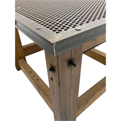 Reclaimed industrial wrought metal and pine table, metal mesh top on pine block supports united by stretchers 