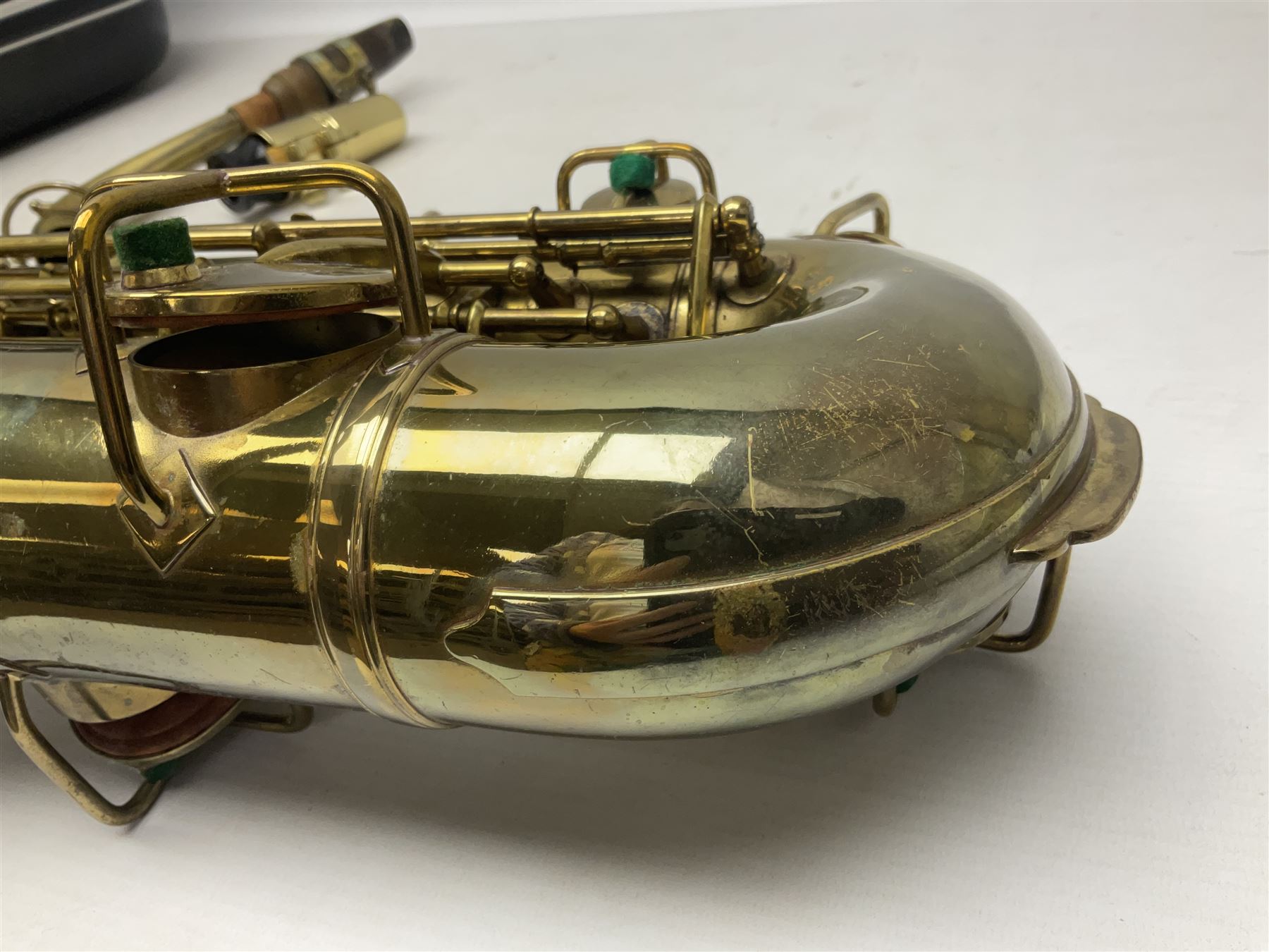 Lacquered brass 'King' alto saxophone inscribed Made by the H.N. White Co.' (Cleveland Ohio) with crook, serial no.84128; also stamped No.1 549 911 and Pat D 8-18-25; in fitted carrying case 