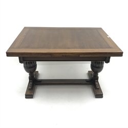 20th century oak drawer leaf dining table, two gadroon cup and cover baluster supports on sledge feet connected by stretcher, 91cm x 122cm - 214cm (extended), H79cm