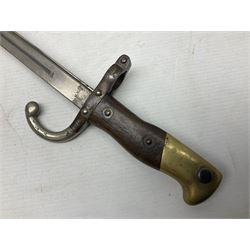 French Model 1866 Chassepot bayonet with 57cm curving fullered steel blade dated 1873 No.L63963; in steel scabbard with conforming number L71.5cm overall; and French St. Etienne Gras bayonet dated 1878 No.K10674 in steel scabbard numbered 79437 (2)