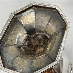 Victorian silver four piece tea service, comprising teapot, teapot stand, twin handled open sucrier and milk jug, each of octagonal form with foliate bud border and engraved decoration including crest to canted panels, and vacant panels, the teapot with ivory finial to the hinged cover and later wooden handle, hallmarked Edward Barnard & Sons Ltd, London1896, teapot including finial H15cm, milk jug including handle H16cm, teapot stand W11.5cm

This item has been registered for sale under Section 10 of the APHA Ivory Act