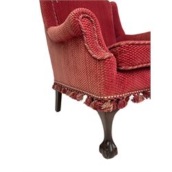 Low armchair, upholstered in textured red fabric, raised on cabriole supports with ball and claw feet
