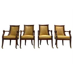 Set of four 19th century mahogany elbow chairs, the curved and rolled cresting rail over the upholstered seat and back with stud work, curved arms with shepherd's crook uprights, on square tapering and splayed supports 