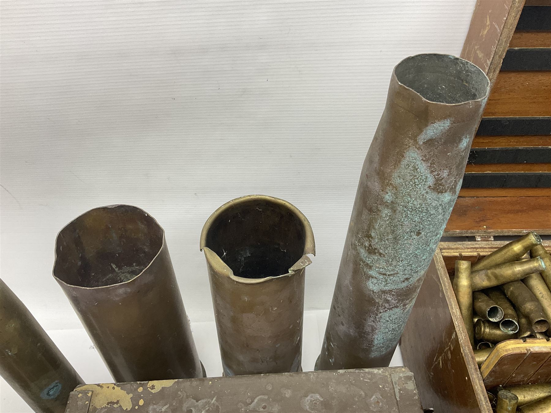Large collection of shell and bullet casings, including a trench art example, together with a metal cartage case and wooden case