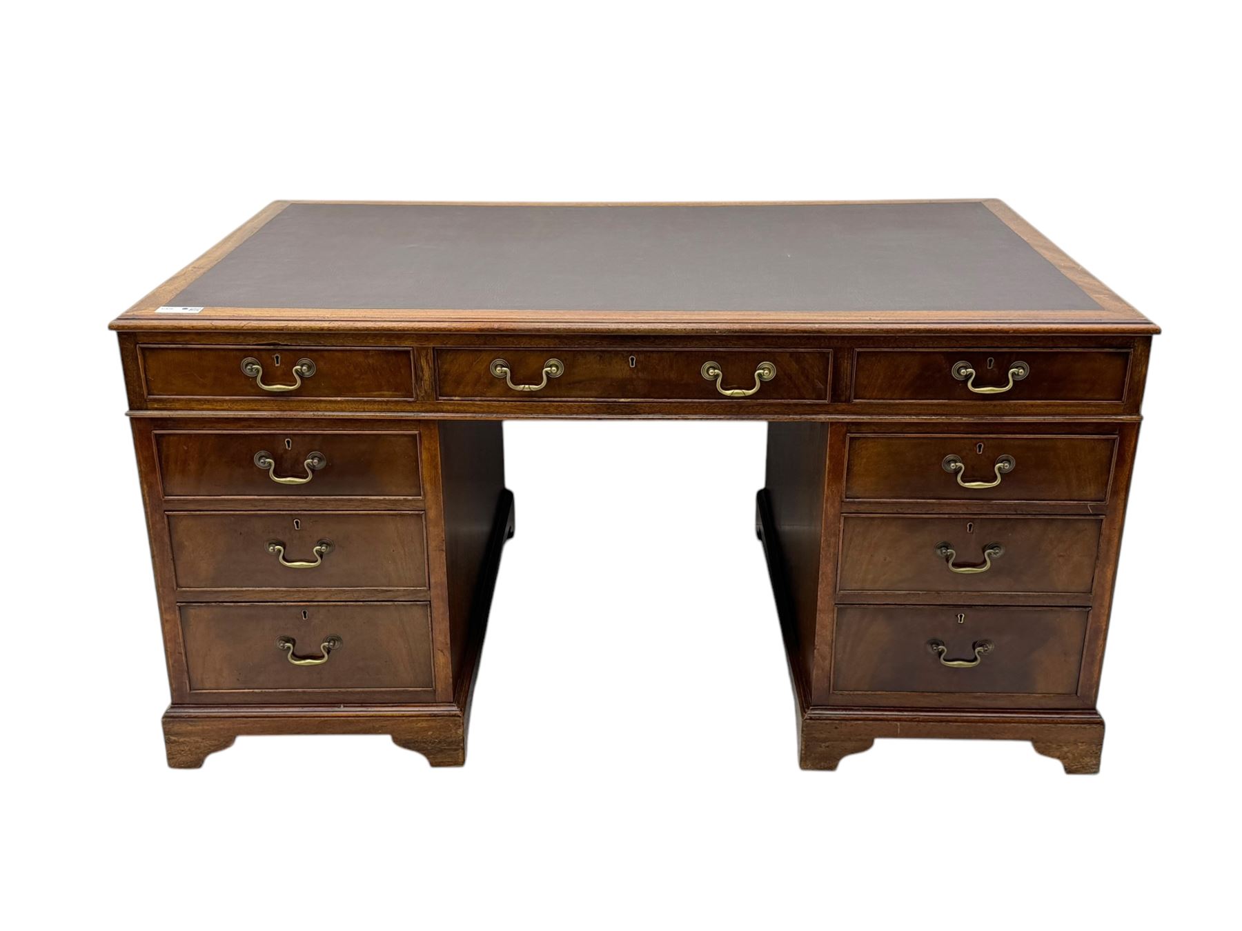 Edwardian mahogany twin pedestal desk, rectangular burgundy leather top moulded edge, over three short drawers with brass swan neck handles, over twin pedestals with graduating drawers supported on bracket feet