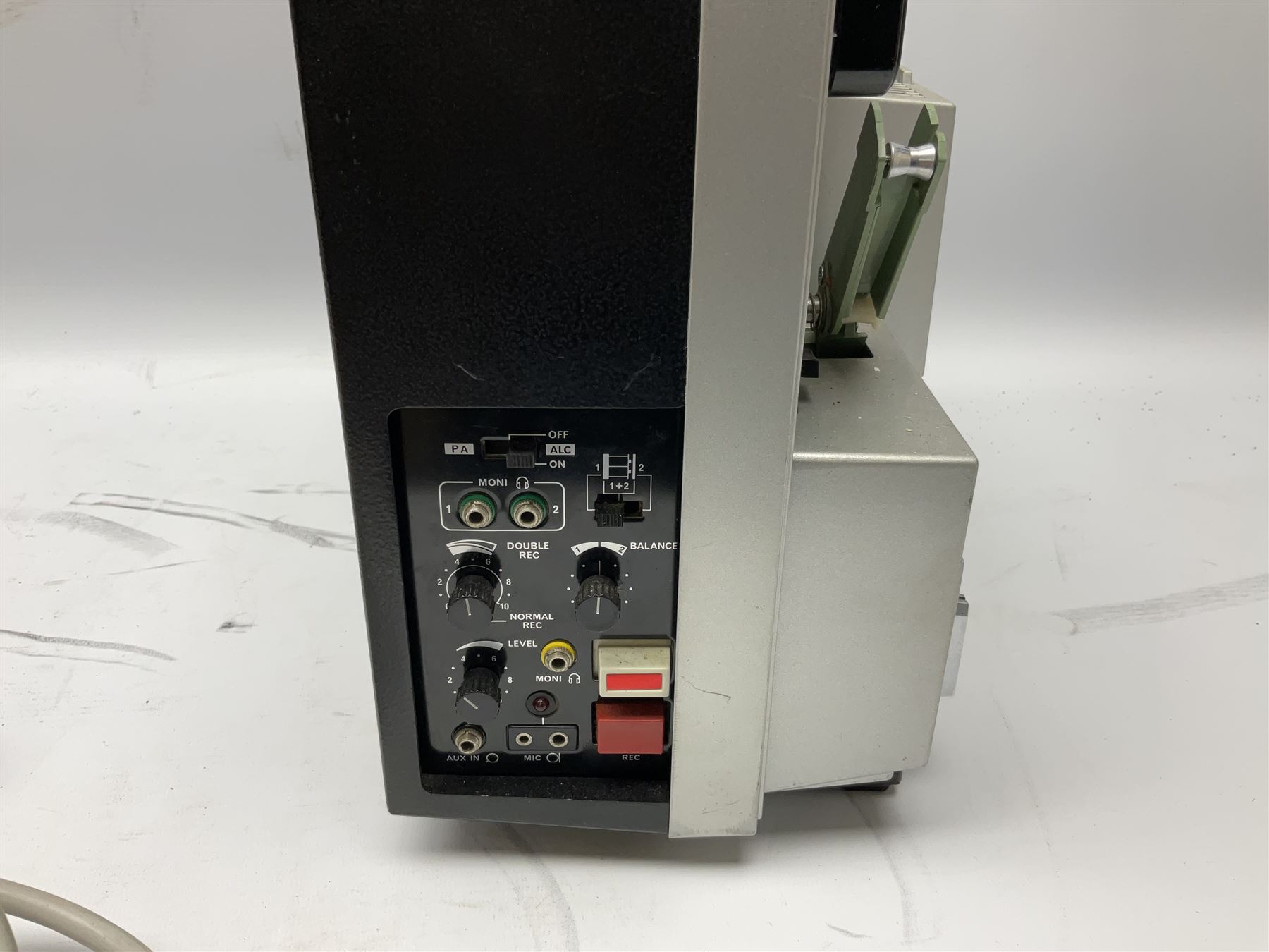 Elmo ST-1200 sound film projector, with instruction manual and black carrying case