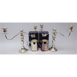  Shop stock: pair silver-plated three branch candelabra and two silver-plated tankards, boxed by Laurence R. Watson & Co.   