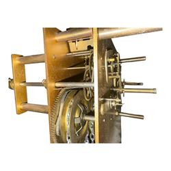 English- Art deco mahogany 8-day longcase clock, with an arched top and fill length fully glazed door beneath, on a short plinth with bracket feet, three train chain driven movement with visible stainless steel cased weights and pendulum, silvered dial with Arabic numerals, minute track and pierced steel hands, quarter chiming movement with  Westminster/ Whittington/ strike/silent selection.
