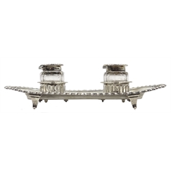  Silver inkstand of shaped rectangular form, gadroon border,  two detachable faceted glass inkwells with silver mounted lids by William Hutton & Sons Ltd, Sheffield 1923 L23cm  