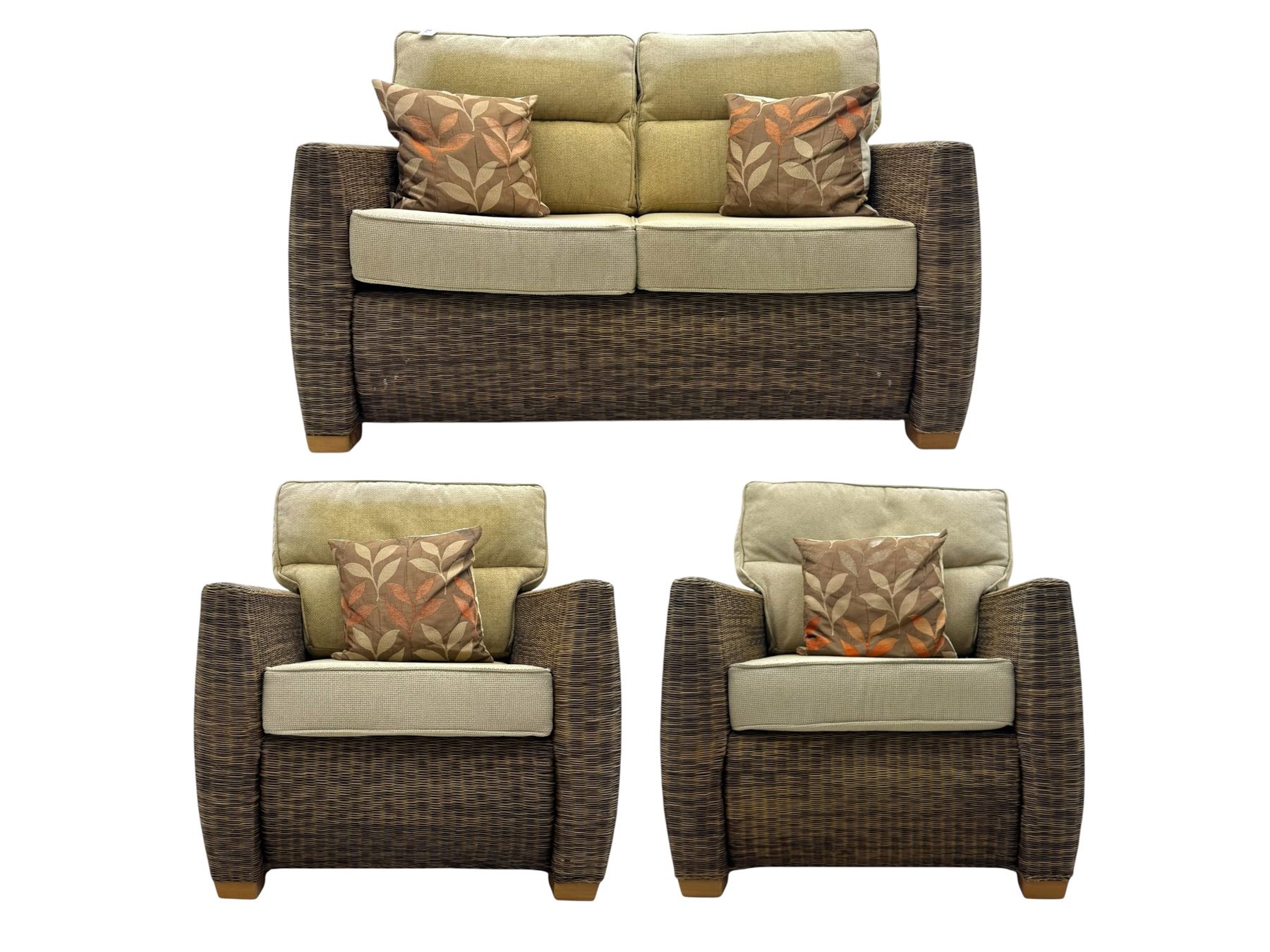 Contemporary two seat rattan conservatory sofa with loose cushions, and pair of matching armchairs, with upholstered seat and back cushions in a beige fabric, curved arms and front complete with scatter cushions 

Chairs (H 92cm, W 75cm, D 84cm)
Sofa (H 92cm, W 130cm, D 84cm)