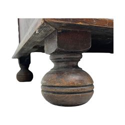 Jacobean-style oak dresser base with two frieze drawers above three cupboards with panelled and moulded decoration, fitted with drop handles, supported on bun feet, circa 1900