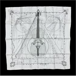 Hermès 'La Musique Des Spheres' silk scarf, designed by Zoe Pauwels in 1996, printed with a Viola Medici surrounded by musical motifs in black, on ivory white ground, with rolled hand stitched edges and Hermes material label, 87cm square