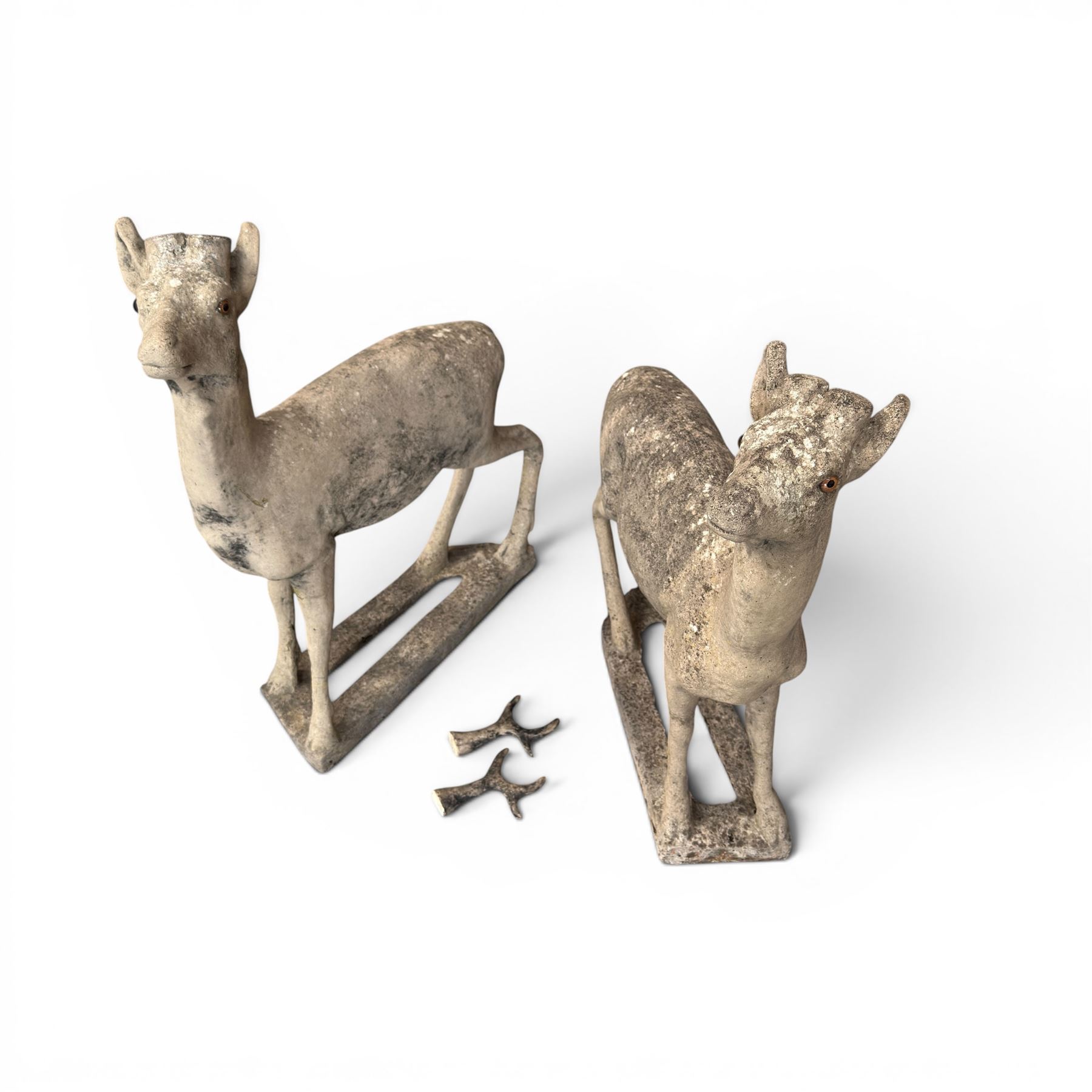 Pair of cast stone garden deer in a weathered finish with two loose antlers