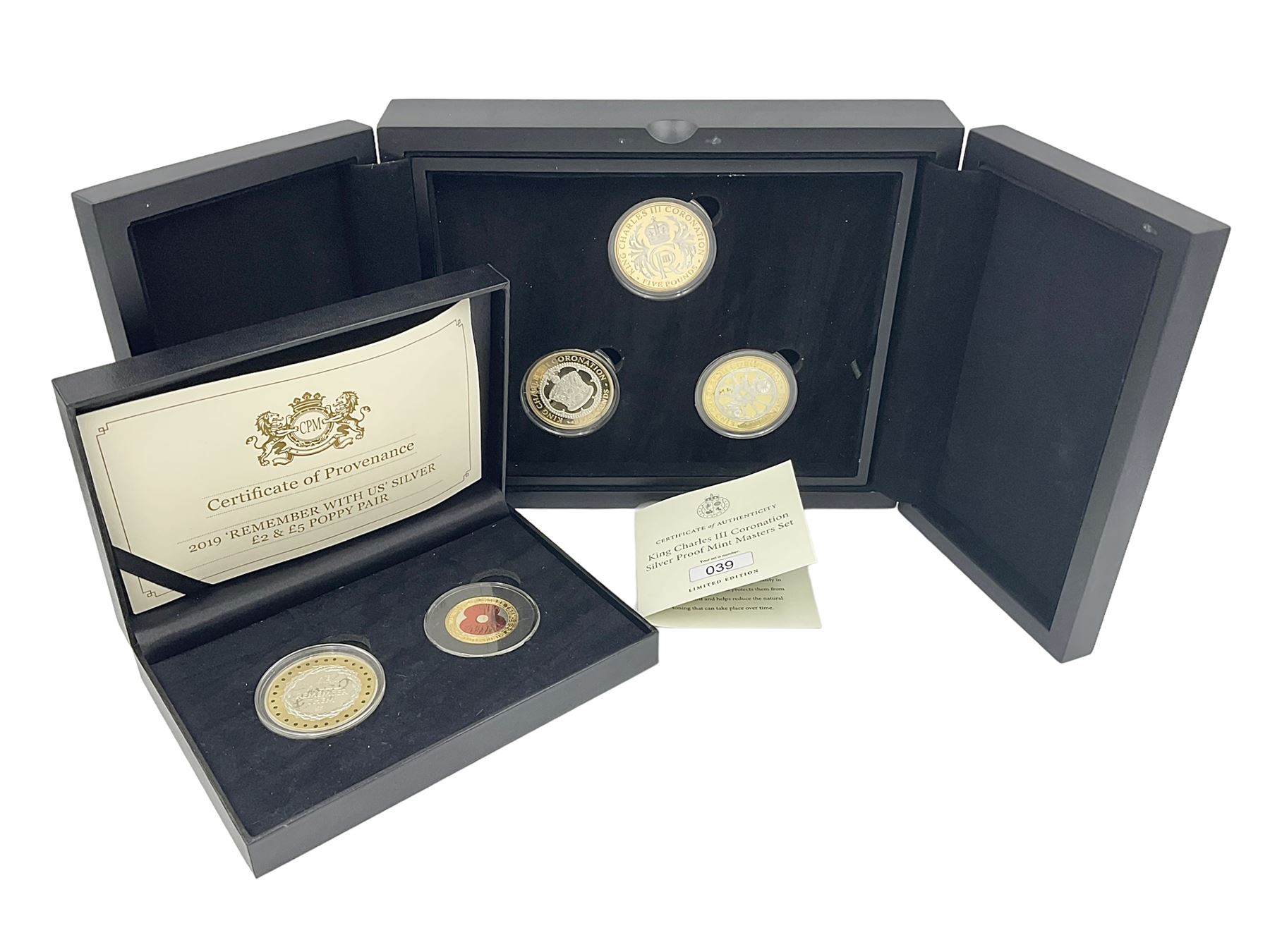 King Charles III 2023 'Coronation Silver Proof Mint Masters Set' comprising Bailiwick of Jersey, Bailiwick of Guernsey and Isle of Man sterling silver proof five pound coins, cased with certificate and Queen Elizabeth II 2019 Bailiwick of Jersey 'Remember With Us' silver two pound and five pound pair, cased with CPM certificate
