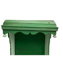 19th century painted pine hen coop settle, overhanging arched canape with dentil moulding and shaped edge, the panelled seat over a triangular platform base with removable hen-coop door, in green and white finish