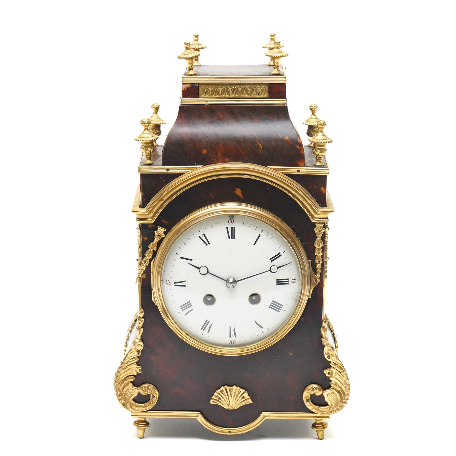 French-late 19th century brown stained 8-day faux Tortoise shell and ormolu mounted mantle clock, rectangular case with glazed side panels and shaped pediment with matching finials, convex enamel dial with Roman numerals, minute track and steel moon hands within a cast brass glazed dial bezel,
twin barrel movement with rack striking, striking the hours and half hour on a coiled gong. With pendulum and key.