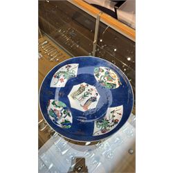 Chinese powder blue ground famille verte charger, possibly Kangxi, decorated with a central cartouche enclosing two female figures, with smaller shaped panels enclosing lions and foliage, square seal mark in blue to base, D28cm
