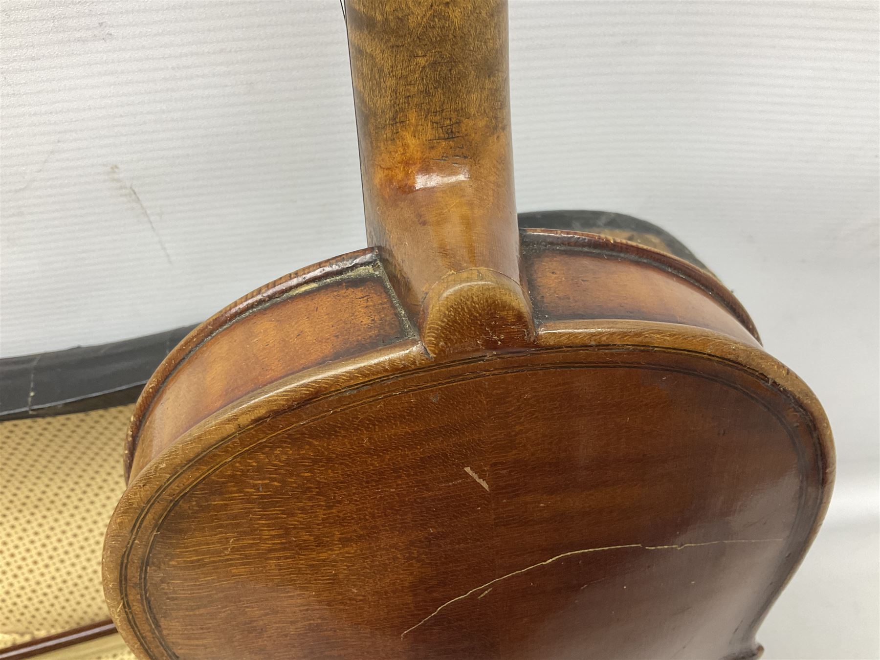 German copy of a Maggini violin c1900 with 35.5cm two-piece maple back and ribs and spruce top, bears label 'Maggini Deutsche Arbeit 1866' L59cm; in carrying case with bow