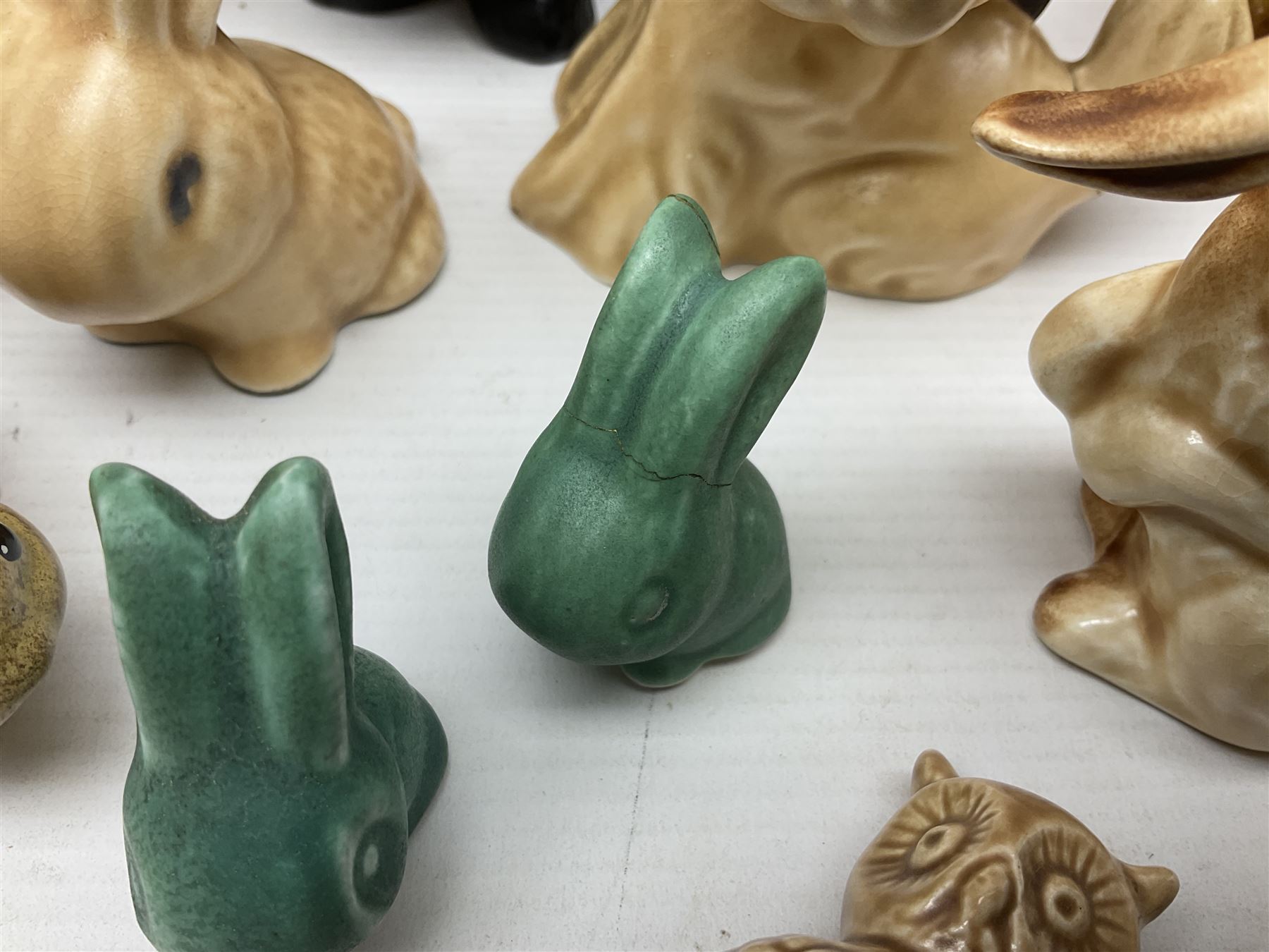 Collection of Sylvac and similar animal figures, including rabbits, hares and dogs, together with Falcon budgie vase, etc 