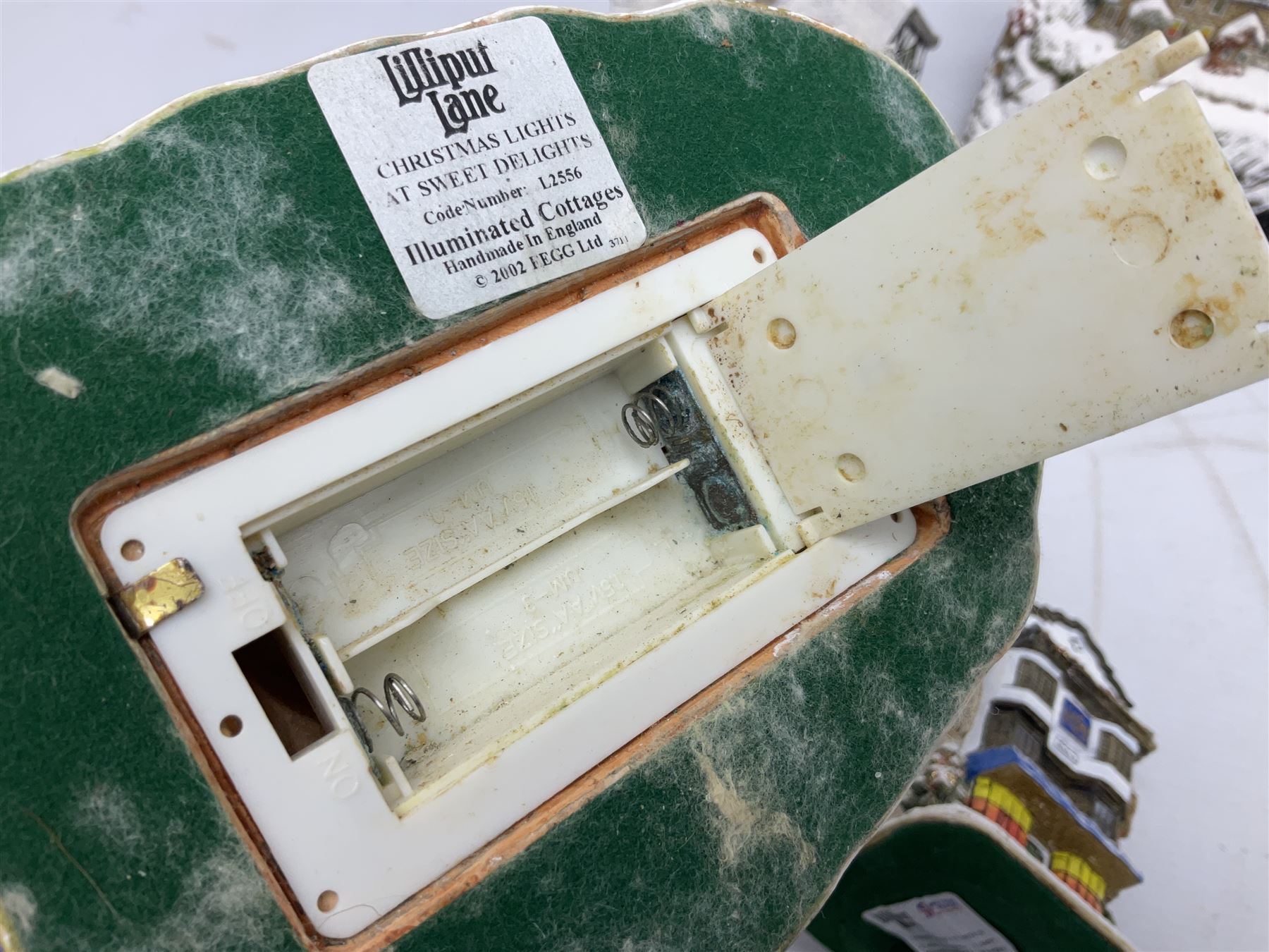 Five Lilliput Lane Illuminated Cottages, comprising Christmas is Coming, with box and deed, Christmas at Mol's, with box and deed, Christmas in Canterbury, with box and deed, Christmas Lights at Sweet Delights and The Three Kings, with box and deeds, together with twelve other Lilliput lanes, to include The First Noel, with box and deed, Winters Moonlight, Yuletide treats, with box and deed etc (17)