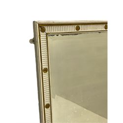 Late 19th century wood and gesso wall mirror, parcel gilt and fluted with flower head rosette decoration
