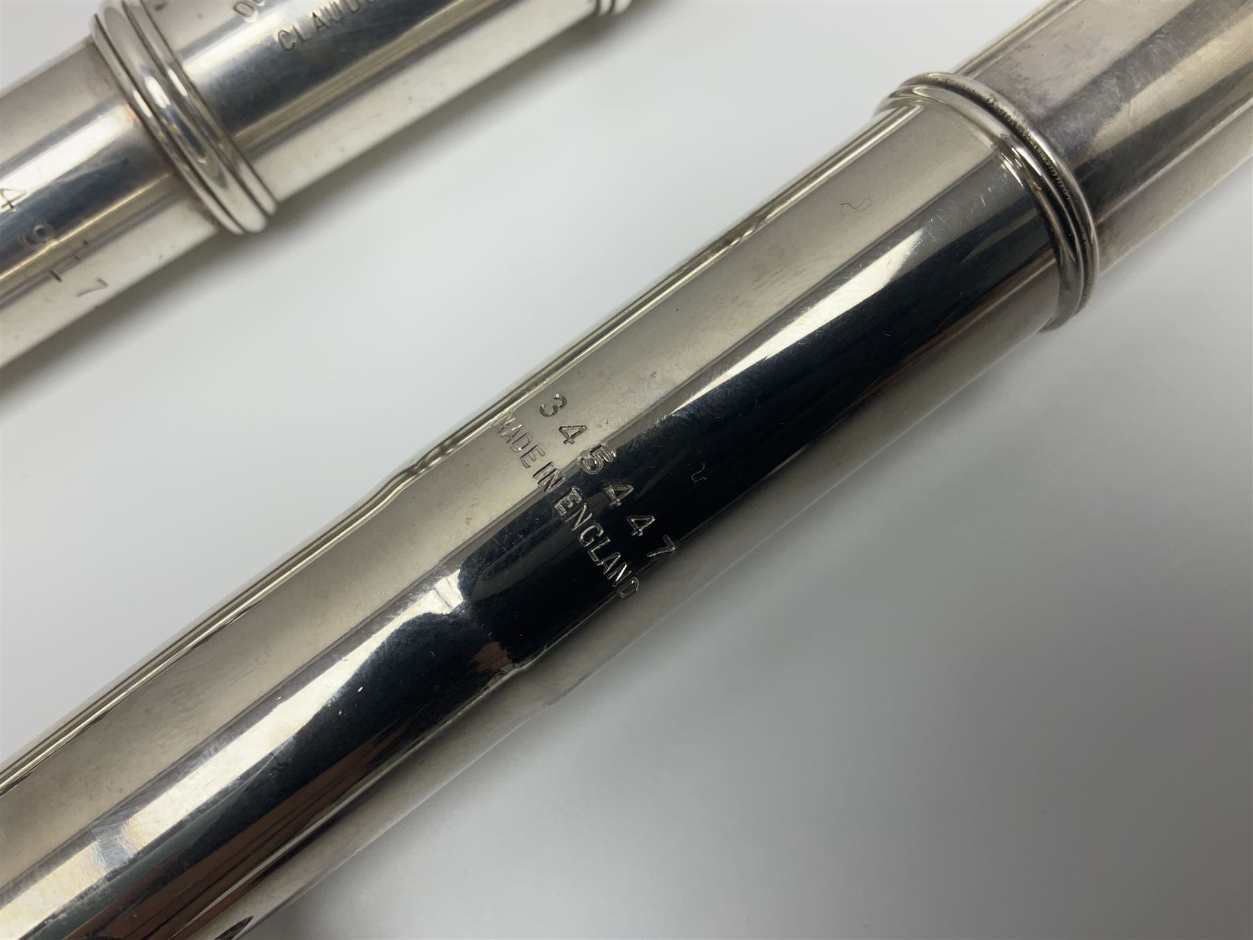 Boosey & Hawkes London Regent three-piece flute, serial no.345447; in B&H Bandhite hard carrying case; and Deg Music Company Inc. USA Claudel Model three-piece flute, serial no.491718, in hard carrying case (2)