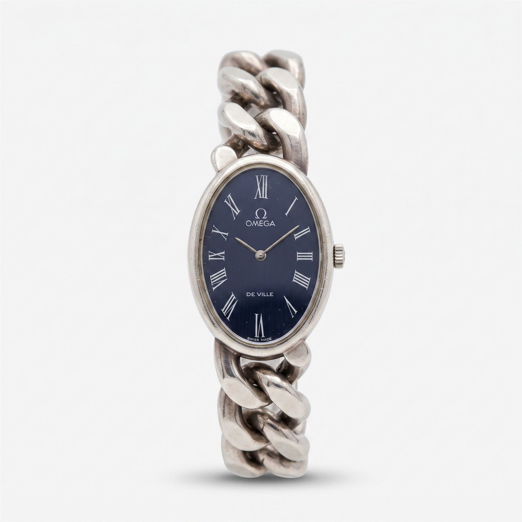 Omega Jeux D'argent De Ville silver manual wind wristwatch, Ref. 8348, Cal 625, oval blue dial with Roman numeral hour markers, on integral silver curb link bracelet, with slide clasp, London import mark 1974, with blue suede case