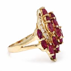 14ct gold ruby and diamond cluster ring, set with fifteen marquise cut rubies and fourteen channel set round brilliant cut diamonds, stamped 585