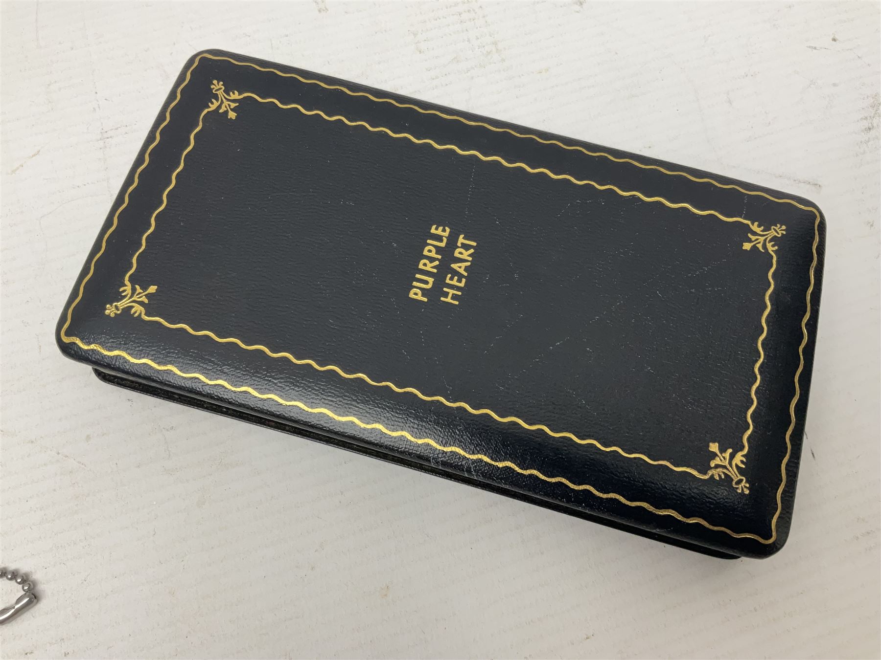 American Purple Heart Medal awarded to 32634848 Charles H. Poppo; cased with identity tags and paperwork; and Bronze Star Medal awarded to U.S. Marine Esteban T. Maranao; cased; American WWII Victory Medal and Asiatic Pacific Campaign Medal