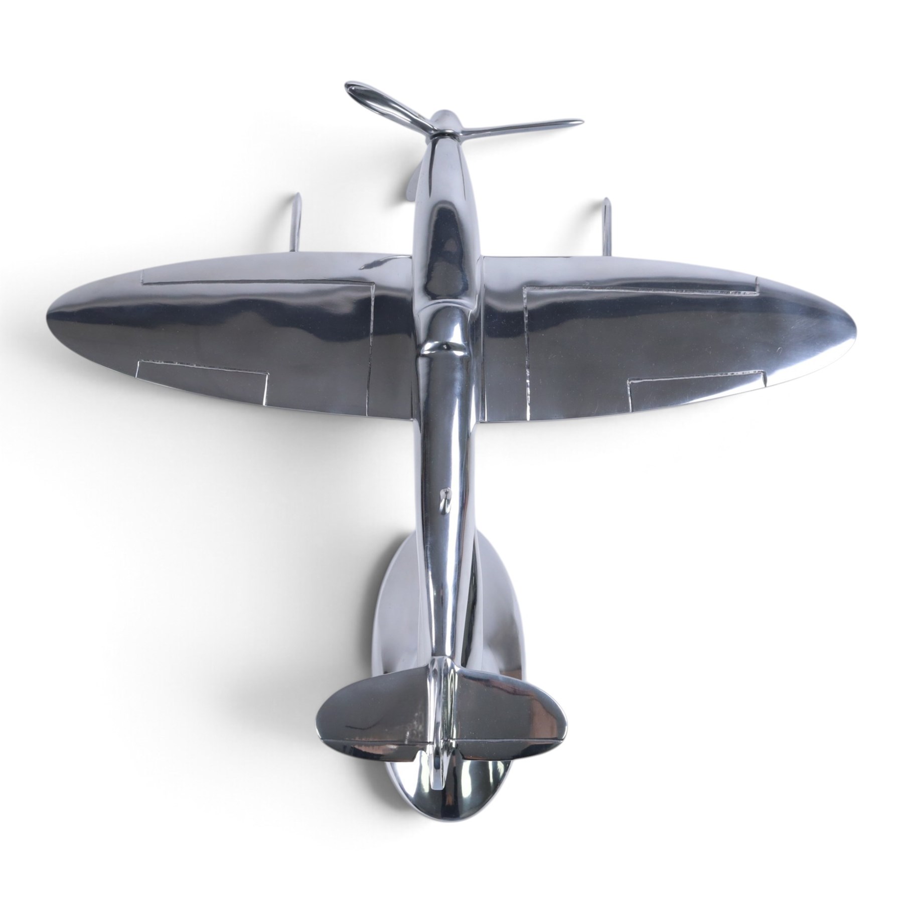 Modern polished metal model of a Spitfire, H36cm