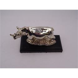 Filled silver model of a rhinoceros by Afrisilver, upon lacquered wooden base, H11.5cm