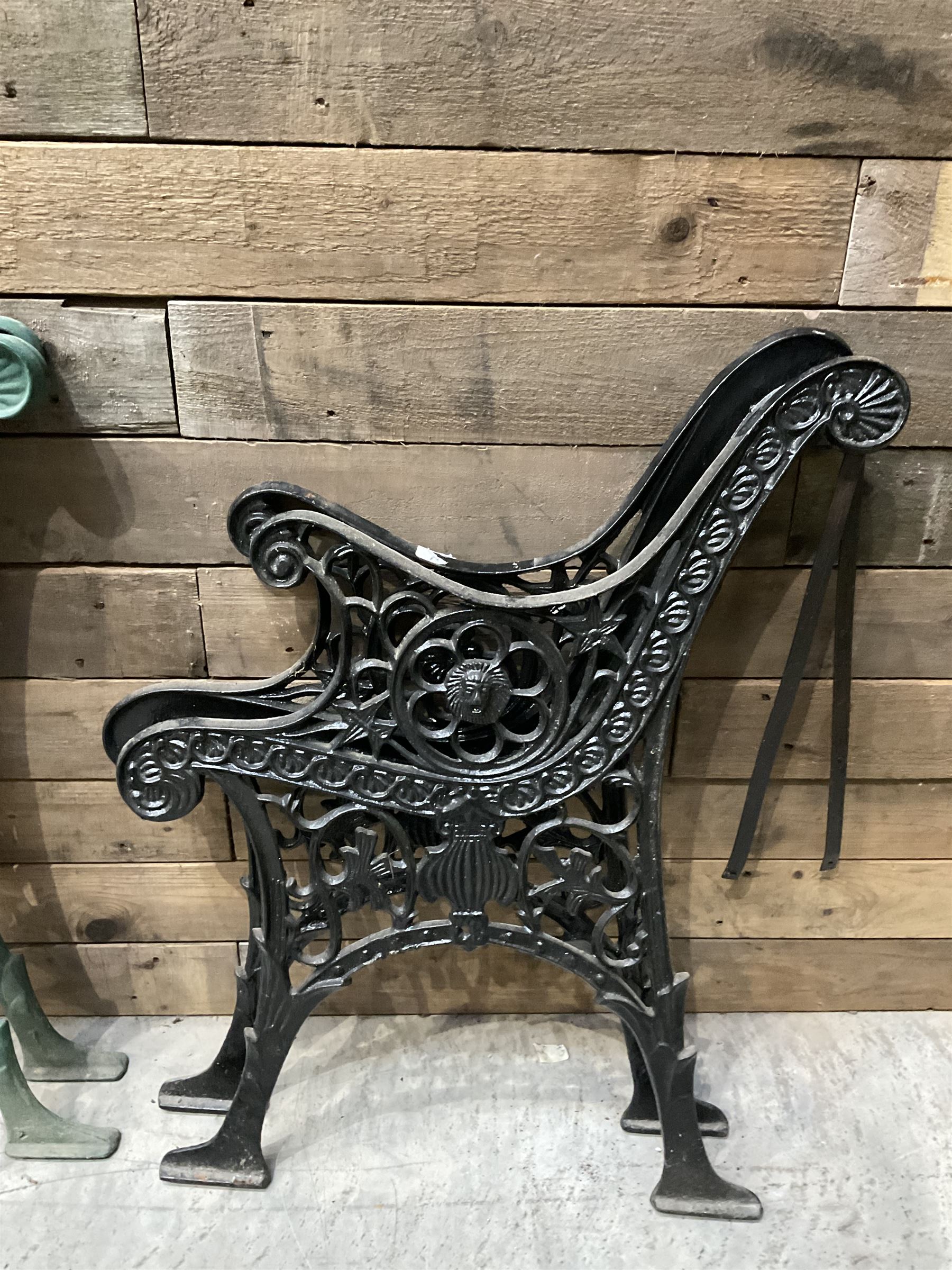 Four pairs of ornate cast iron bench ends (8)