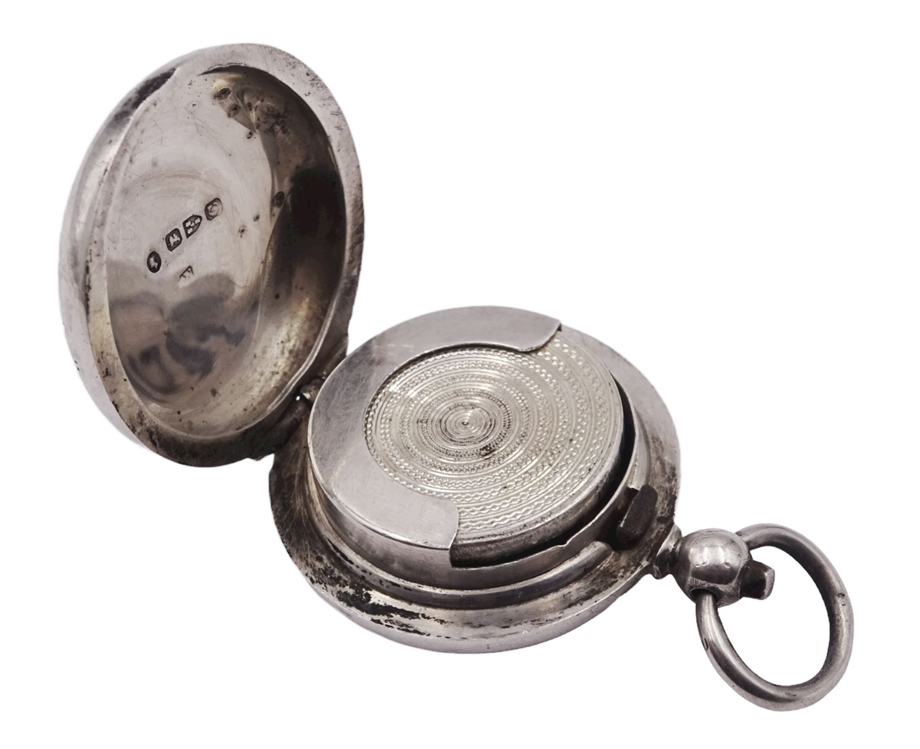 Late Victorian silver sovereign case, of plain circular form with engine turned sprung platform to interior, hallmarked Chester 1886, makers mark worn and indistinct, approximate weight 0.60 ozt (18.7 grams)