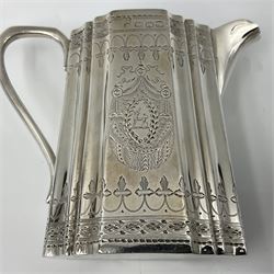 Victorian three-piece silver tea service, comprising teapot, twin handled open sucrier and milk jug, of oval form with shaped rim and C handles, each engraved with crests and bands of strapwork decoration, the milk jug and sucrier with gilt interiors, hallmarked Josiah Williams & Co, Exeter 1881, the teapot with ivory insulators and finial, all contained with a tooled leather, blue silk and velvet lined fitted case, retailed by West & Sun, Dublin 
This item has been registered for sale under Section 10 of the APHA Ivory Act