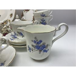 Royal albert Country Rose tea set for six, comprising teacups, saucers, dessert plates, cake plate, covered sucrier and milk jug, together with another tea set  