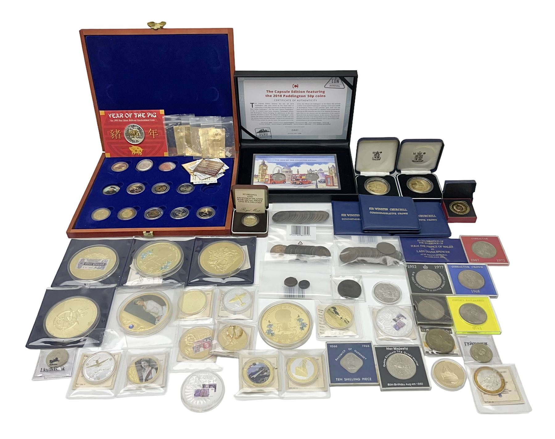 Mostly commemorative and fantasy coinage including commemorative crowns, 2018 'The Capsule Edition featuring the 2018 Paddington 50p coins' in display case, The Royal Mint Solomon Islands 2007 one ounce fine silver five dollars coin on card etc