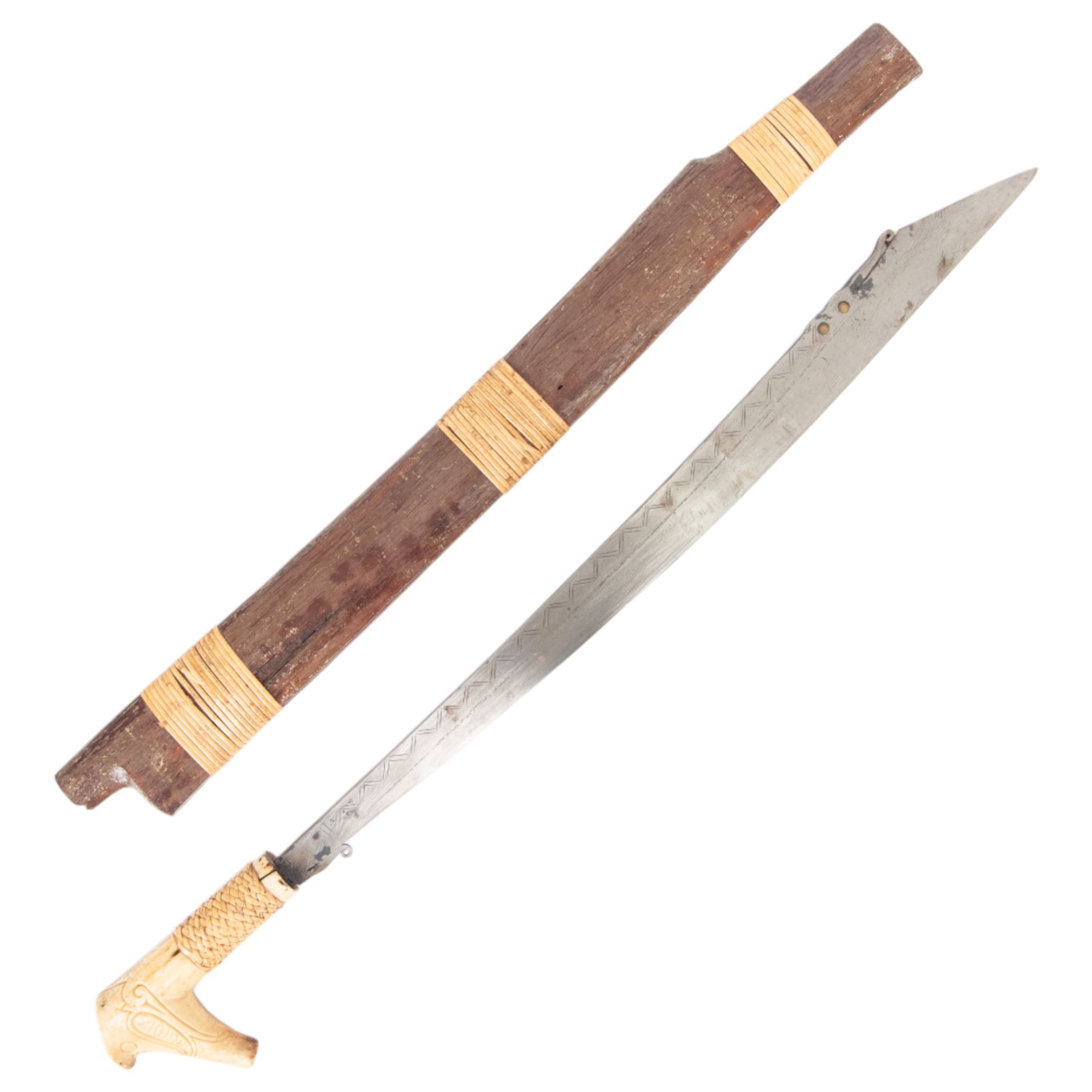 Borneo Dayak Mandau knife, with carved bone handle and wooden scabbard, overall L64cm