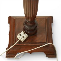 Hepplewhite design mahogany standard lamp, fluted column support with ring turned details, raised on a stepped square base with out-swept feet, fitted with a shaped red fabric lampshade