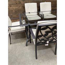 Metal framed garden table with glazed top (W170cm, D102cm, H71cm) and six armchairs with cushions 