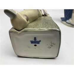 Three Lladro figures, comprising Little Jester no 5203, Pals Forever no 7686 and Naughty Girl no 5006, H25cm