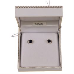 Pair of 9ct gold blue stone stud earrings, boxed