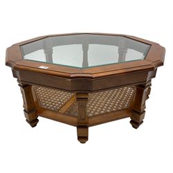 Octagonal coffee table with glass inset, square supports joined by cane undertier