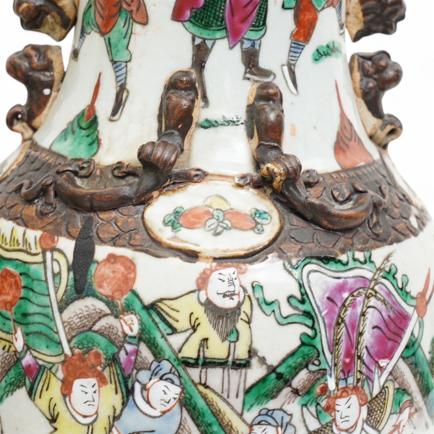 Pair of late 19th/Early 20th century Cantonese baluster vases decorated with warriors and mythical beast handles on a white ground H44cm 